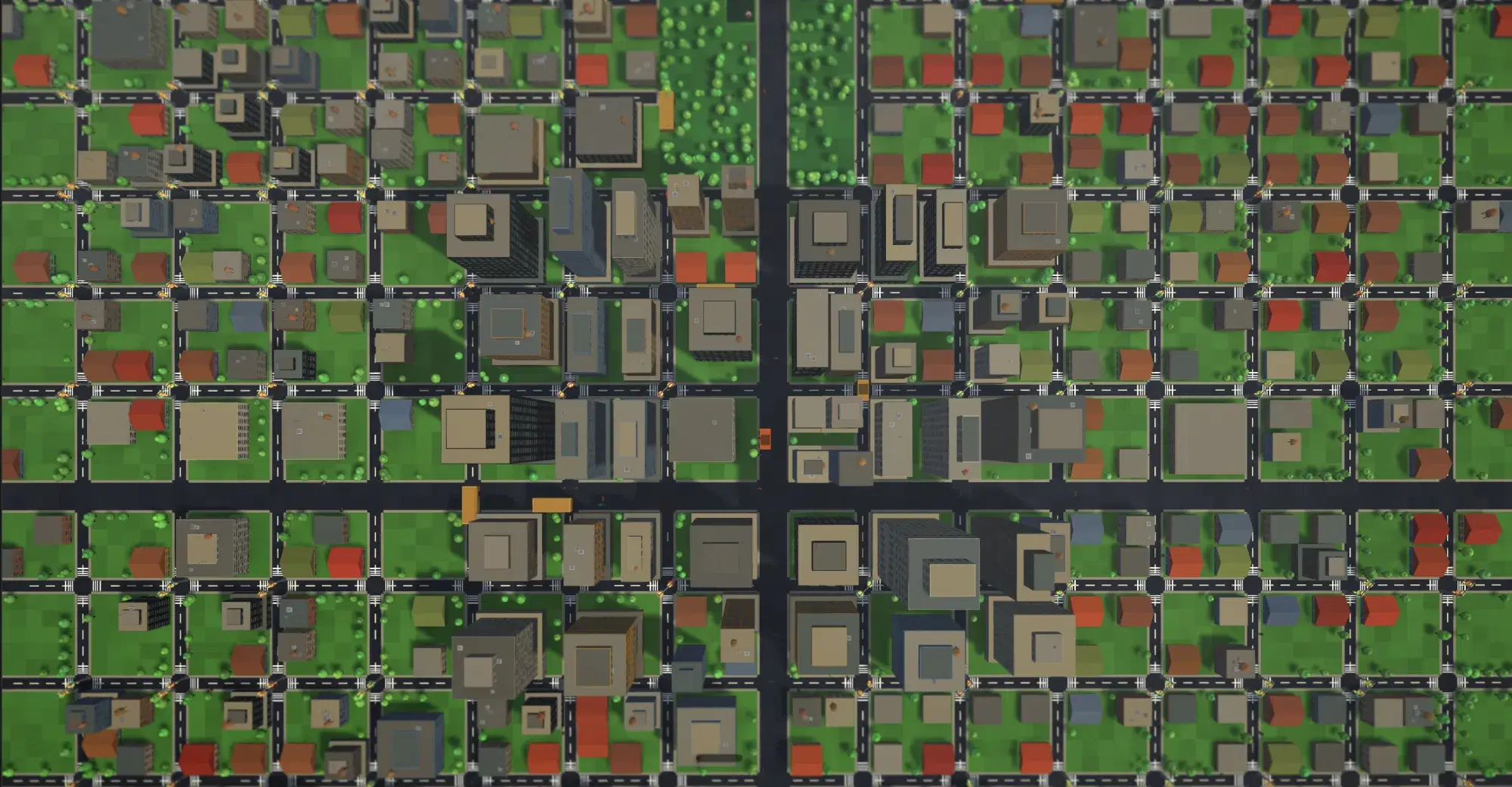 Straight-down aerial photograph of zeldaCity: the full street grid, rooftops, tree-lined blocks and buses on the avenues.